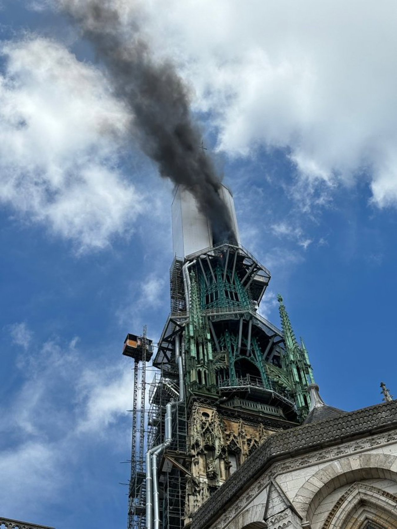 Fire in towering spire of medieval cathedral in French city of Rouen is under control