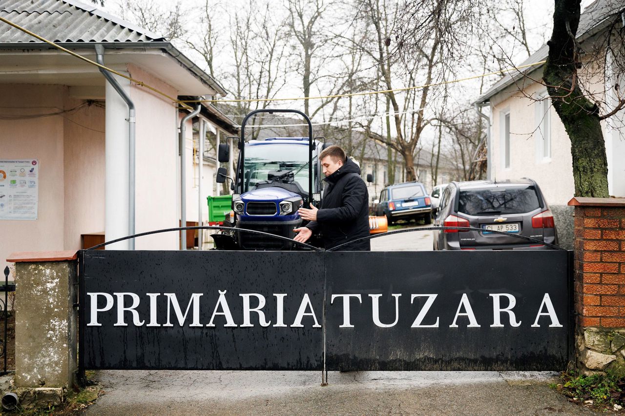 Mayor from Moldova lends a hand to elderly villagers, driving a tractor to tidy gardens