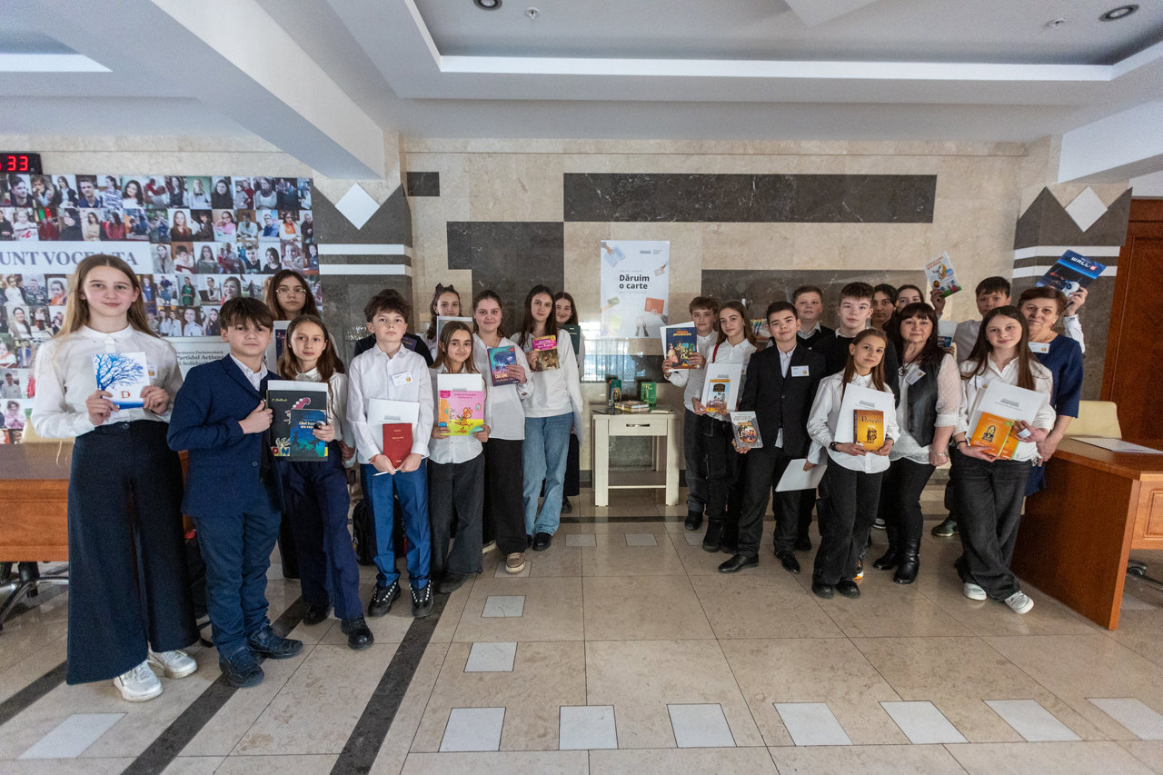 Dozens of children and young people joined "Give a Book" campaign