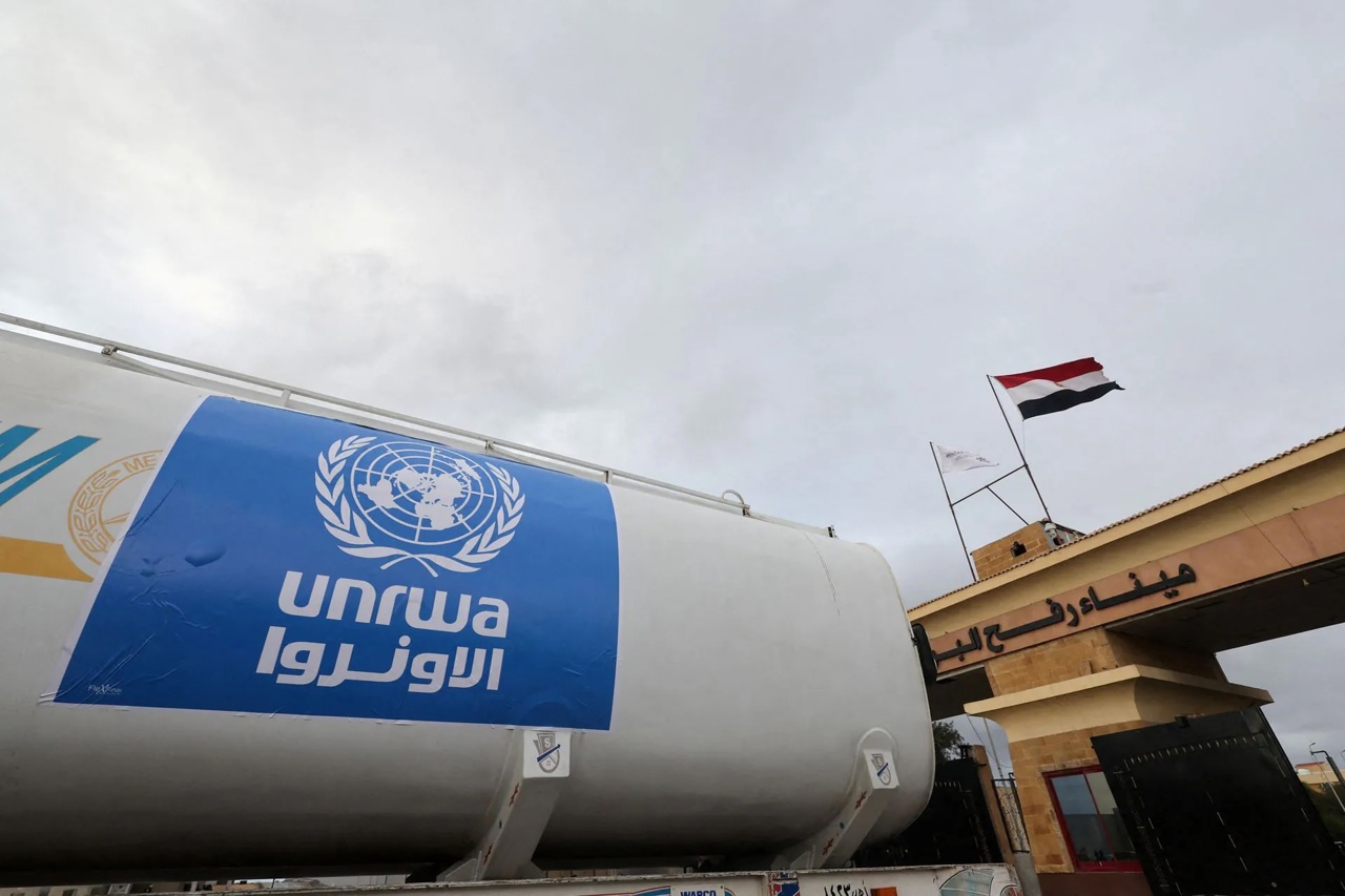 Reuters / A truck, marked with the UNRWA logo, crosses into Egypt from Gaza at the Rafah border crossing between Egypt and the Gaza Strip, during a temporary truce between Hamas and Israel, in Rafah, Egypt, November 27, 2023