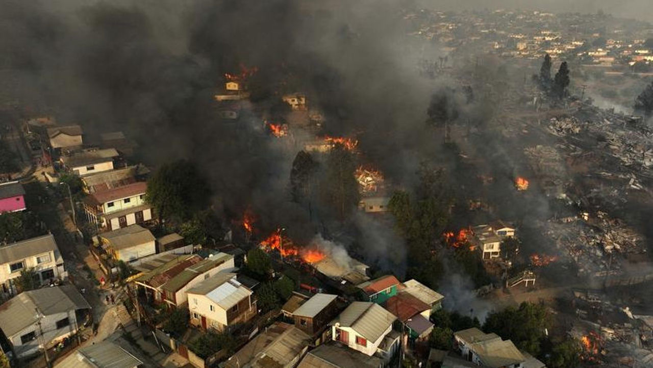 Dozens killed in Chile as forest fires rage in densely populated central areas